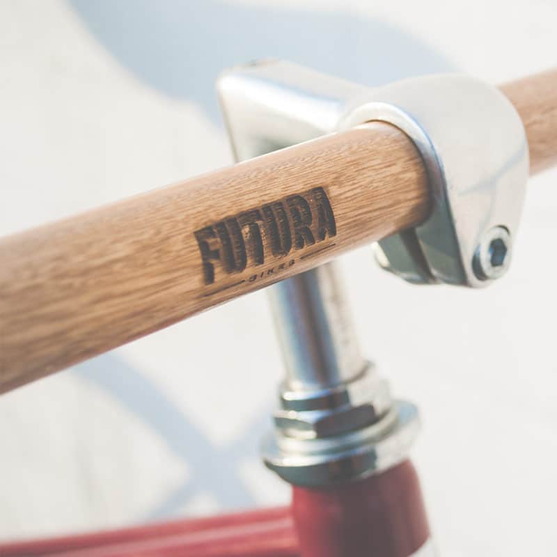 A wooden handle bar with the word futura written on it.