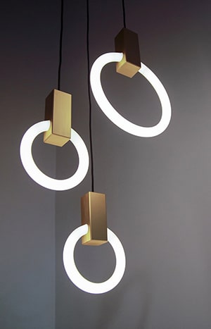 A group of three lights hanging from the ceiling.