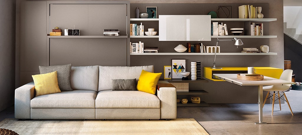 A living room with a couch and shelves