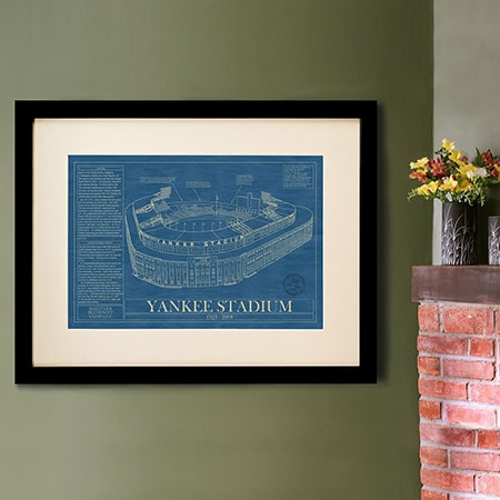 A blue print of yankee stadium in a frame.