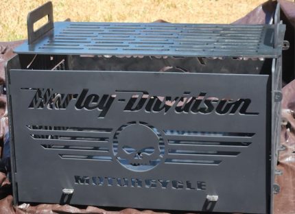 A harley davidson motorcycle grill sitting on top of a table.