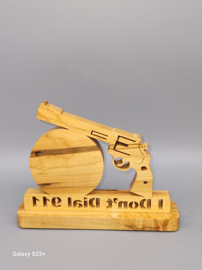 A wooden gun with the words " i 'm not 1."
