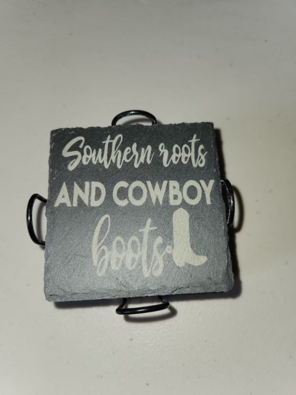 A square slate coaster with the words " southern roots and cowboy boots ".