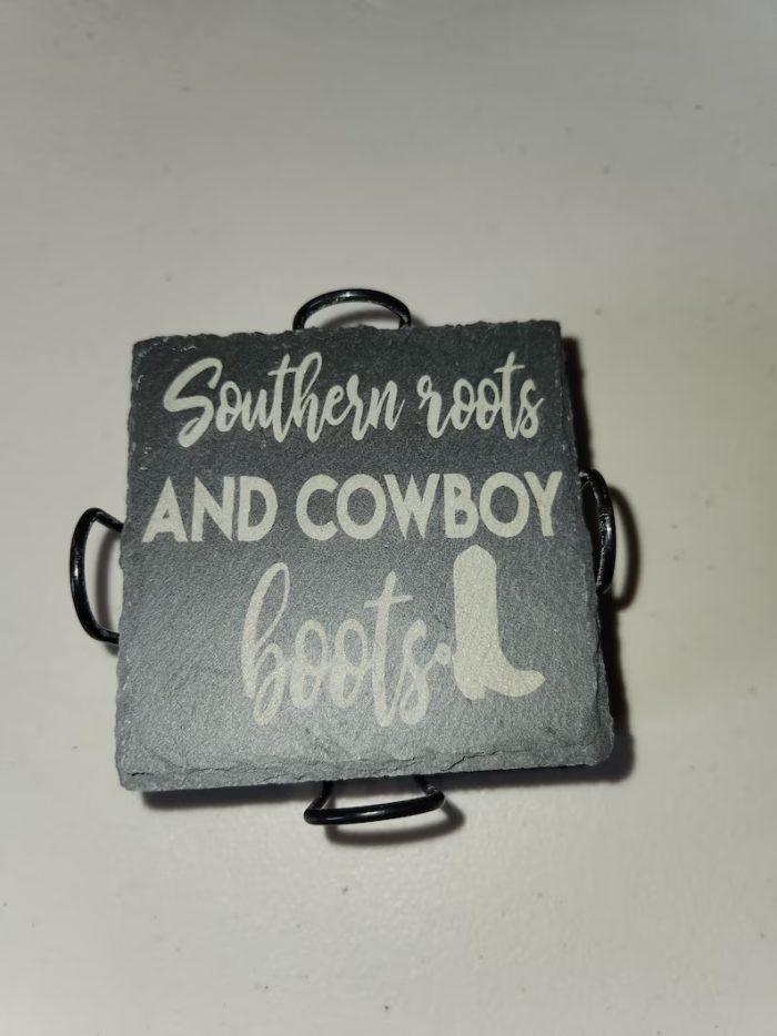 A square slate coaster with the words " southern roots and cowboy boots ".