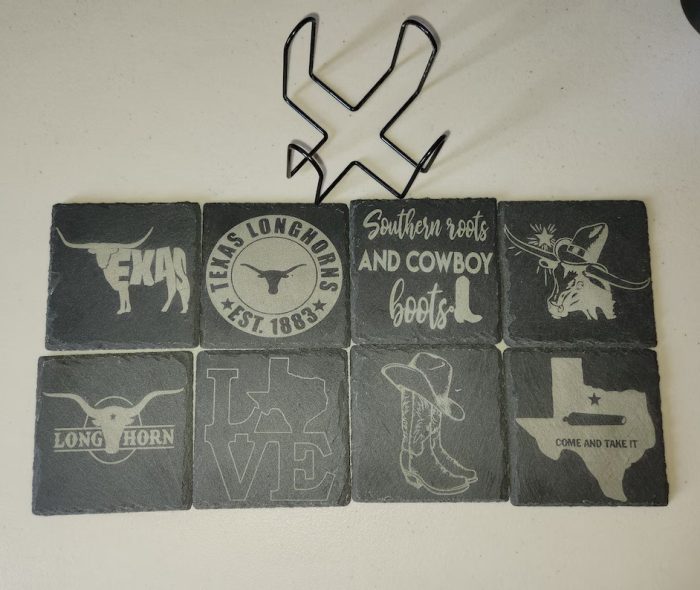 A bunch of coasters that are on the wall