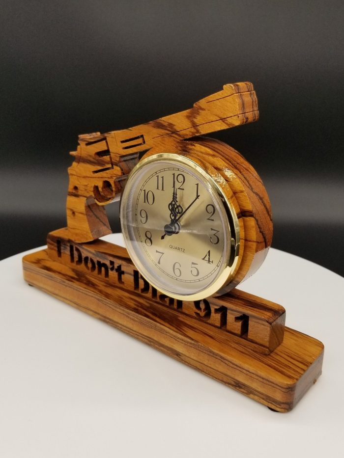 A wooden clock with the words " i don 't dial 9 1 1 ".