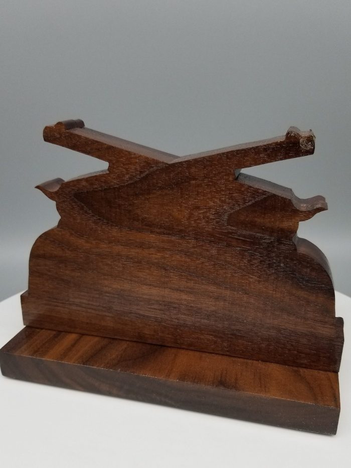 A wooden stand with two pieces of wood on top.