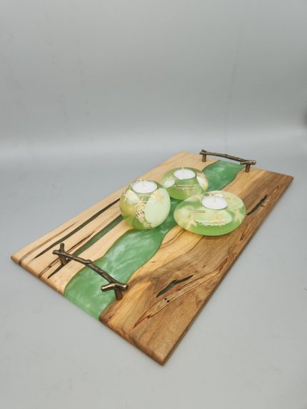 A wooden board with green glass on top of it