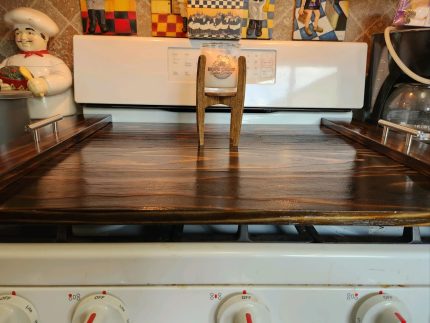 A stove top with wooden covers on it