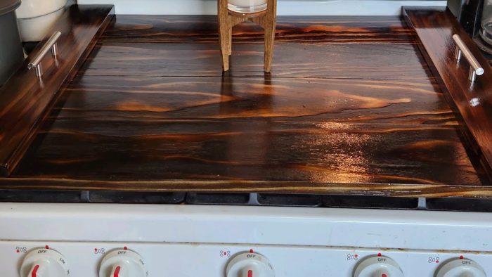 A wooden stove top with a chair on it.