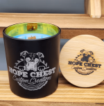 A candle that is sitting on top of a wooden table.