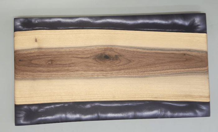 A wooden board with some leather on it