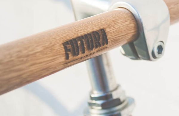A wooden handle bar with the word futura written on it.