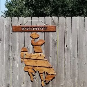 A wooden sign with the words wyoming on it.