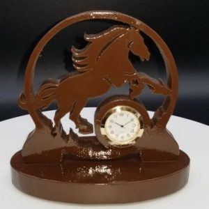 A chocolate clock with a horse on it