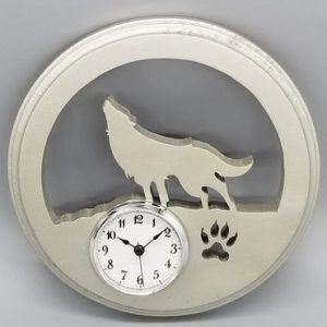 A clock with a wolf and paw print on it