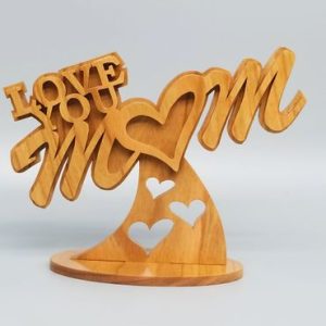 A wooden sculpture of the words love mom