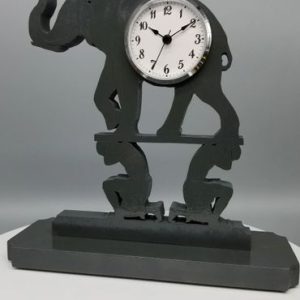 A clock with an elephant on it's back.