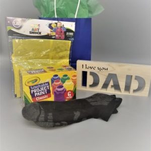 A bag of crayons and a card with the words " i love you dad ".