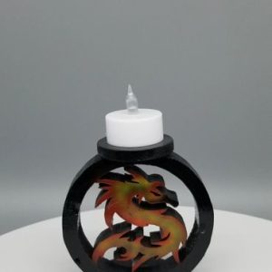 A candle holder with a dragon on it
